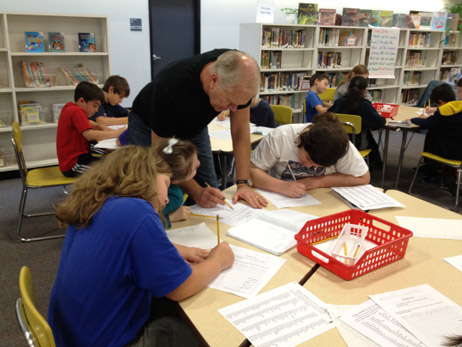 Steve helping students with their writing